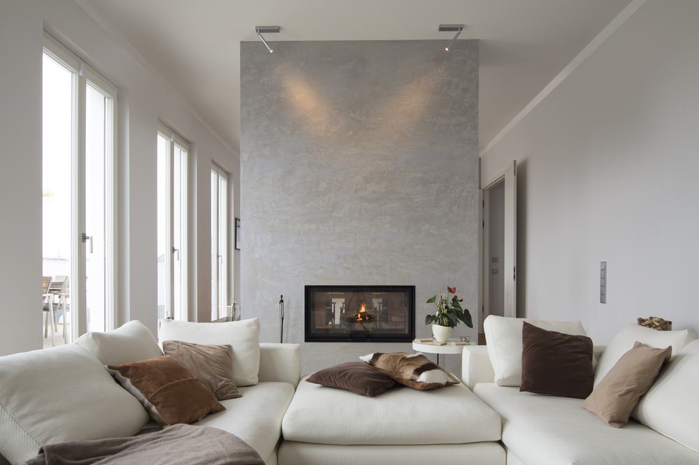 Modern living room with fireplace in a custom home built by Berm Inc.