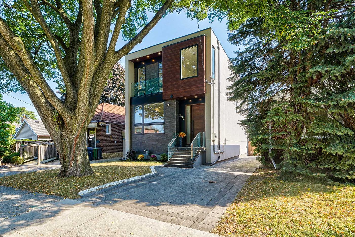 Modern two-storey home facade and driveway — Berm Inc. project photo