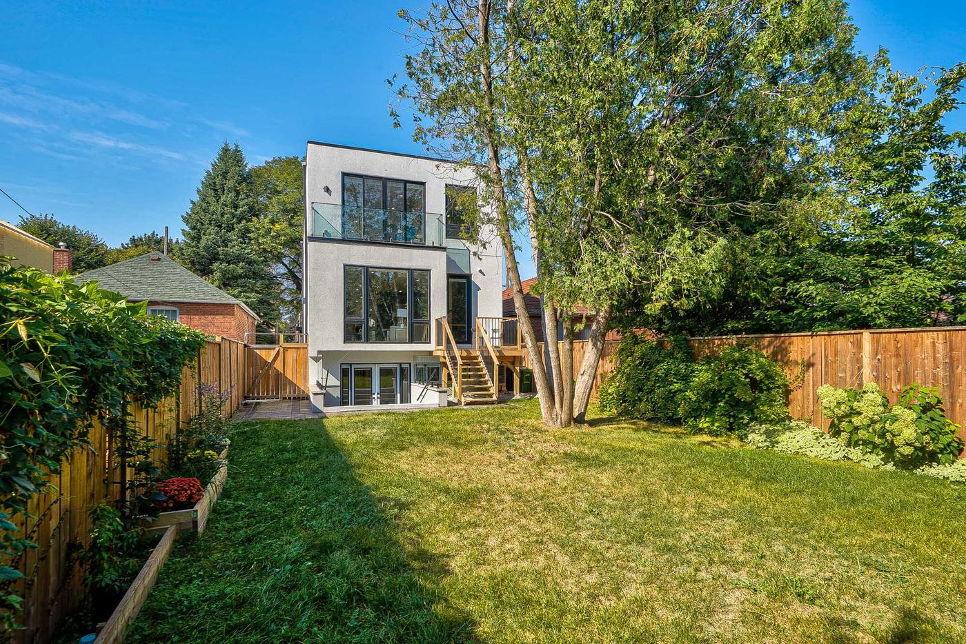 Rear facade and landscaped backyard — Berm Inc. project photo