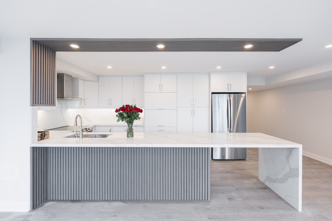 Kitchen with waterfall island — Berm Inc. project photo